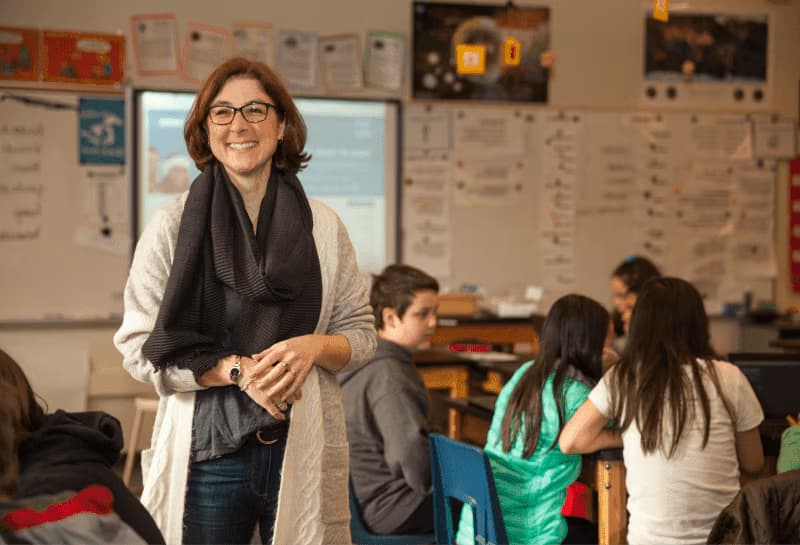 Image of a teacher and students.